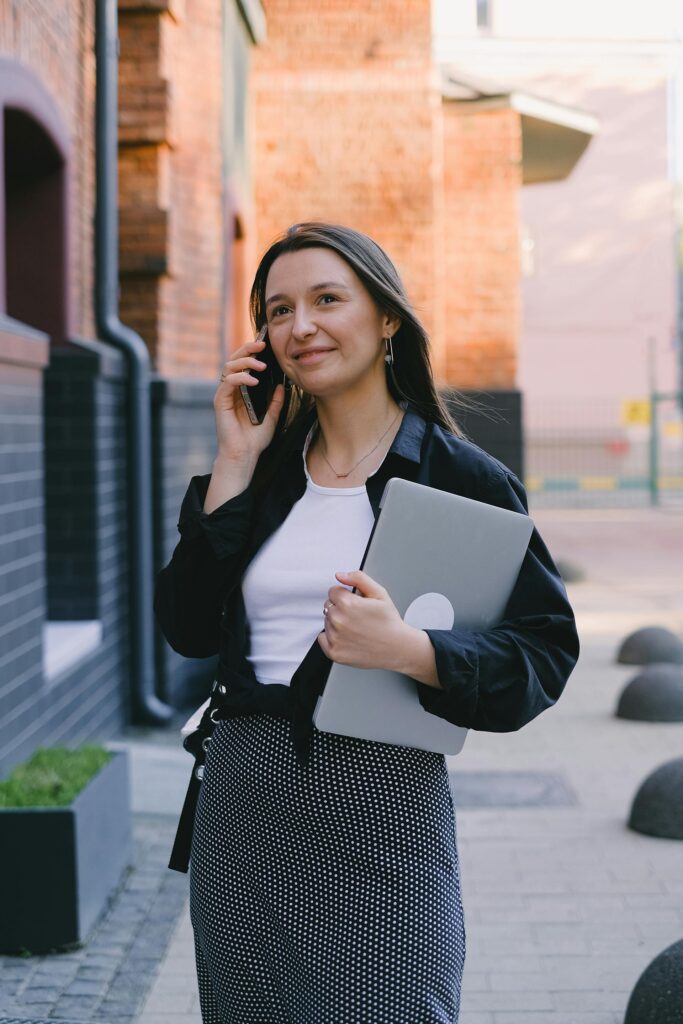 Customer smiling on phone call with the best small business answering service